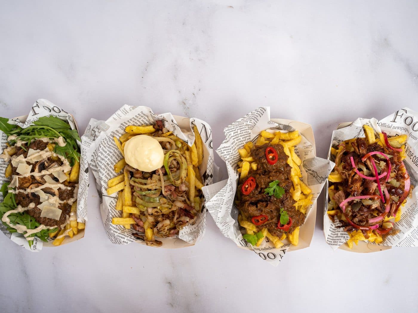 Vier bakjes loaded fries